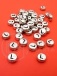 Мънисто 7х4мм метализе буква L отвор 1мм 1пак 100бр 318611